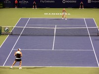 Alisa Kleybanova and Maria Sharapova on Centre Court.