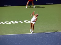 Aleksandra Wozniak of Canada serving.