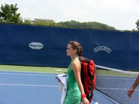 Iveta Benesova leaving tennis court after loss to Ai Sugiyma.