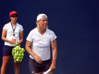 Martina Navratilova practicing serve at Rogers Cup 2009.