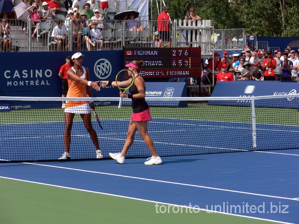 Sharon Fichman and Anne Keothavong shaking hands.