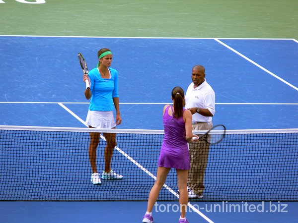 Julia Georges and Jelena Jankovic with coin-toss.