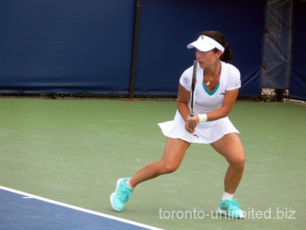 Jie Zheng of China returning a ball. Rogers Cup 2011.