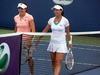 Brianti and Zheng walking off the court.