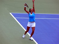 Julia Georges serving against Serena Williams