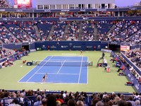 Jovanovski and Sharapova playing at sunset.