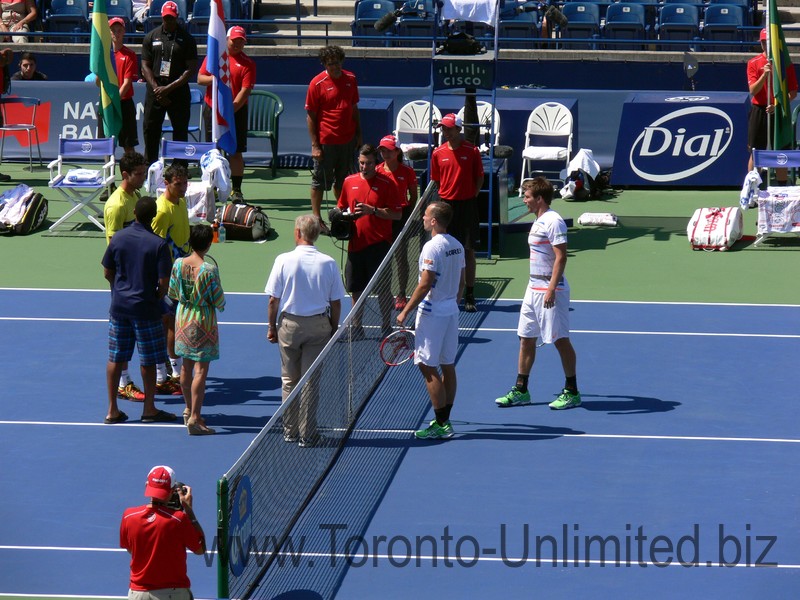 Ivan Dogic (CRO) Marcelo Melo (BRA) on the left and Alexander Peya (AUT) Bruno Soares (BRA) area ready for coin toss. August 10, 2014 Rogers Cup Toronto 