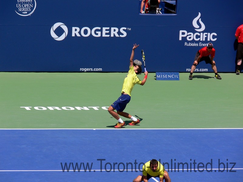 Ivan Dogic (CRO) serving with Marcelo Melo. Doubles Final August 10, 2014 Rogers Cup Toronto