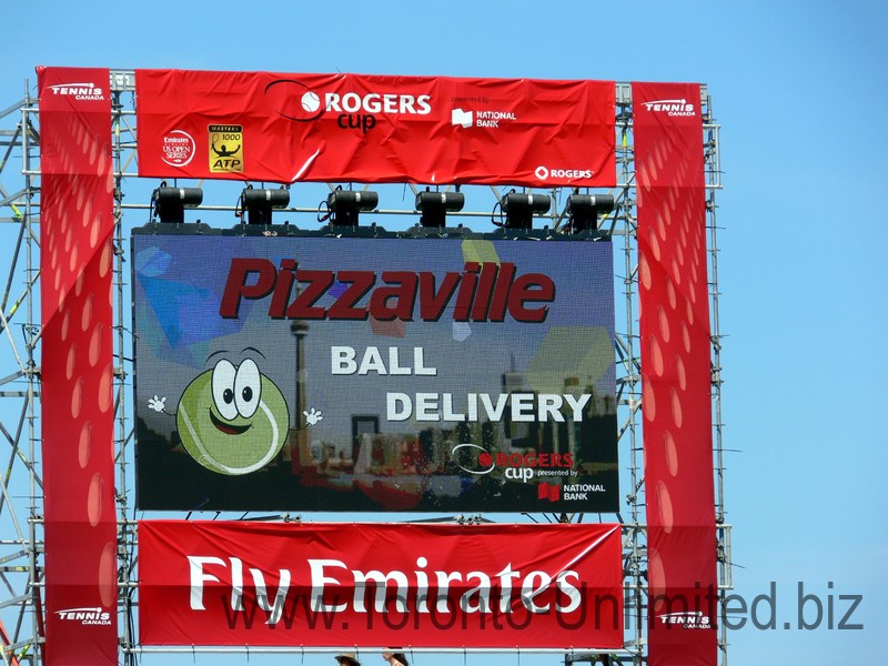 Pizzaville Ball Delivery promotion on the scroreboard. August 10, 2014 Rogers Cup Toronto