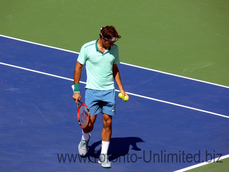 Rogers Federer during warmup on the Stadium Court with Tsonga; August 10, 2014 Rogers Cup Toronto