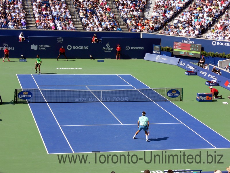 Roger Federer and Jo-Wilfried Tsonga in the second set on the Stadium Court August 10, 2014 Rogers Cup 