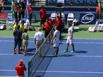 Ivan Dogic (CRO) Marcelo Melo (BRA) on the left and Alexander Peya (AUT) Bruno Soares (BRA) area ready for coin toss. August 10, 2014 Rogers Cup Toronto 