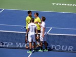 Winners Alexander Peya and Bruno Soares shake hands with Ivan Dogic and Marcelo Melo. August 10, 2014 Rogers Cup Toronto