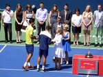 Leslie Tayles, VP of personal banking National Bank presents cheques to the runner-ups Ivan Dogic and Marcelo Melo. August 10, 2014 Rogers Cup Toronto 2014 