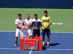 The winners Alexander Peya, Bruno Soares and runner-ups on the right, Marcelo Melo and with Ivan Dogic; all holding their Trophies August 10, 2014 Rogers Cup Toronto  