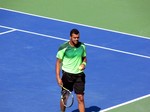 Jo-Wilfried Tsonga during the warmup with Roger Federer August 10, 2014 Rogers Cup Toronto