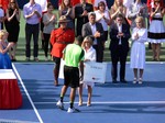 Leslie Tayles VP of National Bank presenting a cheque for $598,900 US to the Champion of Rogers Cup Jo-Wilfried Tsonga August 10, 2014  