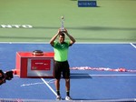 Jo-Wilfried Tsonga and his 2014 Rogers Cup Championship Trophy 