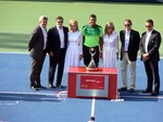 Jo-Wilfried Tsonga surranded by Rogers Cup organizing committee August 10, 2014 Rogers Cup Toronto