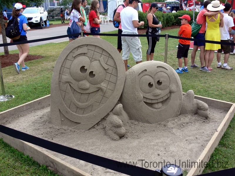 Sand sculptures showing a racquet and tennis ball, at Rogers Cup Toronto 2014