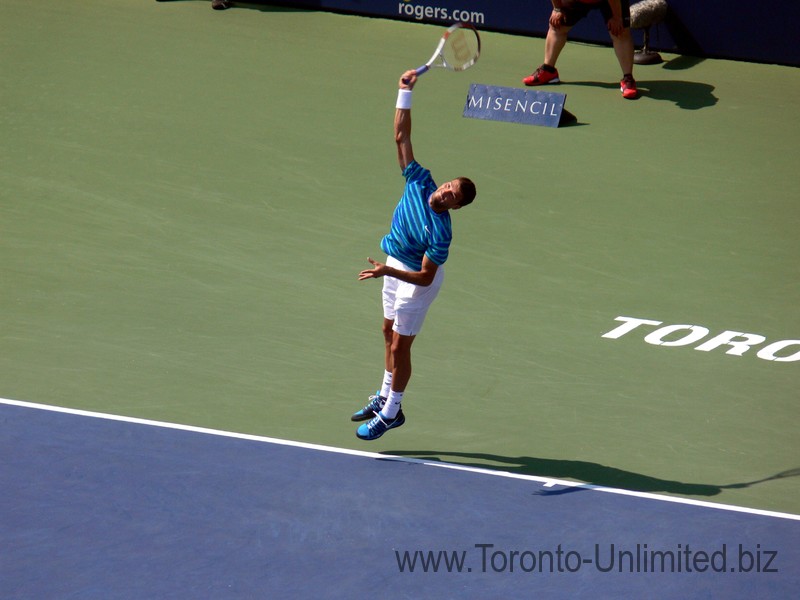 Grigor Dimitrov (BUL) serving on the Stadium Court to Tsonga, August 9, 2014 Rogers Cup Toronto