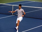 Novak Djokovic exercises on the practice court August 7, 2014 Rogers Cup Toronto