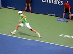 Kevin Anderson (RSA) on the run playing Stan Wawrinka on Centre Court August 7, 2014 Rogers Cup Toronto