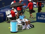 Novak Djokovic sitting during changeover, playing Jo-Wilfried Tsonga August 7, 2014 Rogers Cup Toronto 