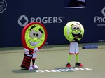 Costume Tennis Racquet and the Ball entertain the spectators during the breaks at Rogers Cup 2014 in Toronto