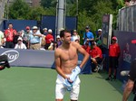 Shirtless and happy Grigor Dimitrov giving his shirt away after the win over Tommy Robredo (ESP) August 7, 2014 Rogers Cup Toronto