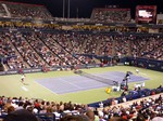 Marin Cilic (CRO) and Rogers Federer (SUI) playing on Stadium Court August 7, 2014 Rogers Cup Toronto