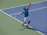 Grigor Dimitrov's back swing to hit his serve. Stadium Court August 9, 2014 Rogers Cup Toronto