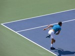 Grigor Dimitrov finishes his serve. Stadium Court August 9, 2014 Rogers Cup Toronto