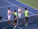 Nedad Zimjonic (SRB) and Daniel Nestor (CDN) shake hands with Alexander Peya and Bruno Soares, the winners. Stadium Court August 9, 2014 Rogers Cup Toronto