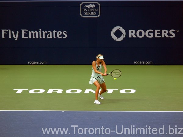 Sharapova returning the ball.