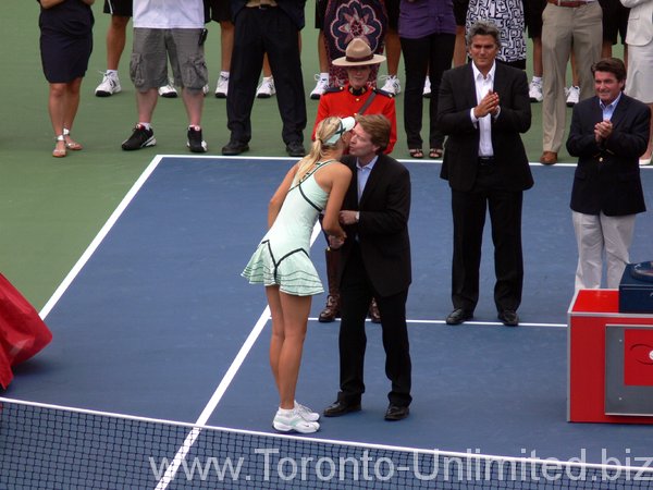 Sharapova, finalist receiving cheque.