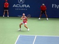 Elena Demetieva returning serve.