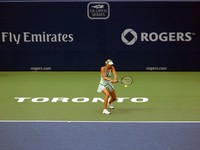 Sharapova returning the ball.