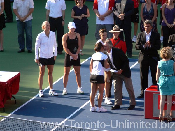 Doubles Champions are being congratulated.