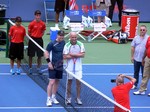 Jim Courier and Andre Agassi posing for photos.