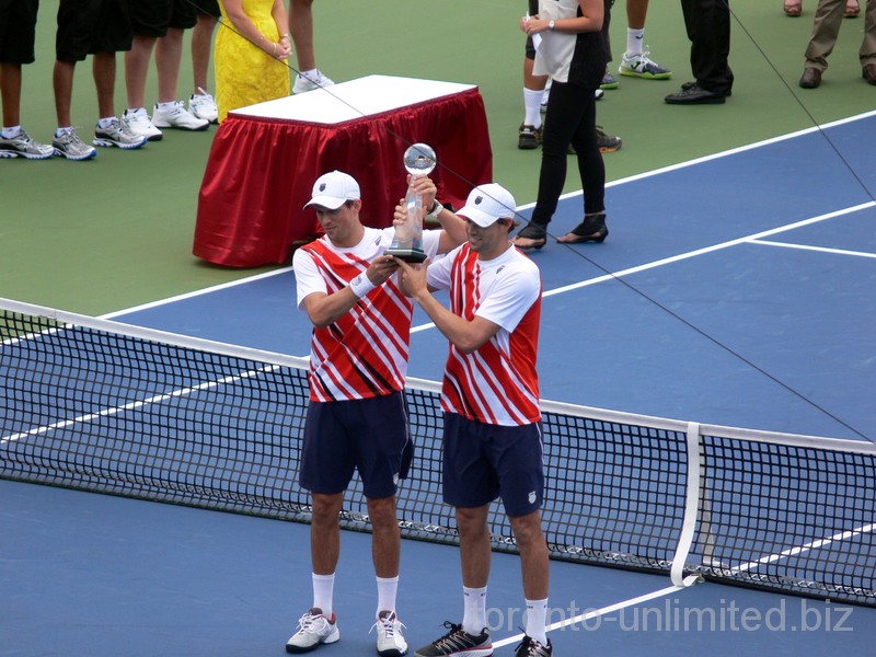 Bob and Mike Bryan are lifting Doubles Championship Trophy. August 19, 2012 Rogers Cup in Toronto.