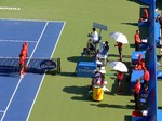 Granollers, Lopez and Mike, Bob Bryan are sitting during changeover, doubles final, August 12, 2012 Rogers Cup in Toronto. 