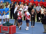 Jubilant Bob and Mike Bryan on Centre Court with their trophies. August 19, 2012 Rogers Cup Toronto.