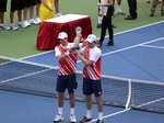 Bob and Mike Bryan are lifting Doubles Championship Trophy. August 19, 2012 Rogers Cup in Toronto.