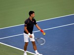 Novak Djokovic is preparing to serve during final match. August 12, 2012 Rogers Cup.