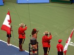 Canadian flags, RCMP, singer and Spidercam TV on Centre Court. August 12, 2012 Rogers Cup.