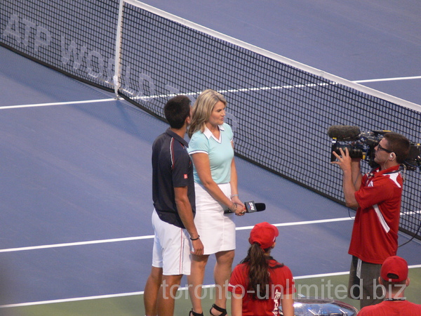 Novak Djokovic won the match and he is giving postgame, on the court interview August 8, 2012 Rogers Cup.
