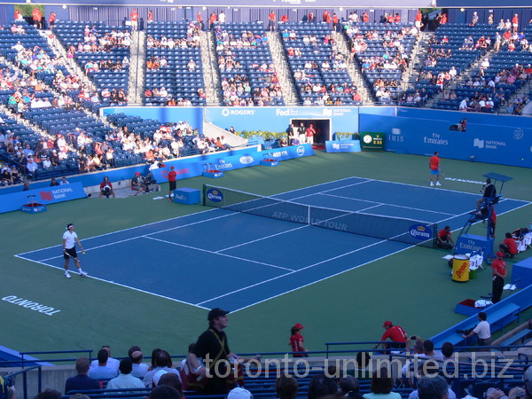 Canadian Milos Raonic and Victor Troicki of Serbia play on Central Court August 7, 2012 Rogers Cup.