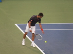 Novak Djokovic serving in the match with Bernard Tomic, Australia on Centre Court, August 8, 2012 Rogers Cup.