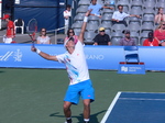 Vasek Pospisil of Canada has a nice serve to Juan Monaco of Argentina, Grandstand Court August 7, 2012 Rogers Cup.